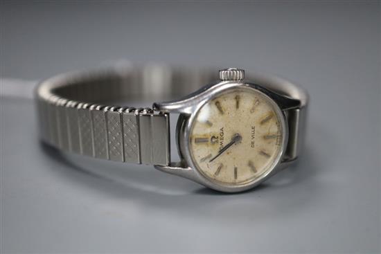 A ladys stainless steel Omega De Ville manual wind wrist watch, on associated strap.